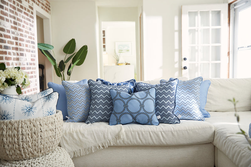 Cushioned Off-White Couch with Blue and White Throw Pillows - Soul